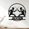 Fencing wall decor displayed on a light paneled wall, featuring two fencers in combat