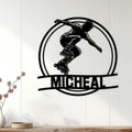 Black inline skater metal wall sign displayed on a light wood-paneled wall