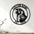 Black parrot metal wall sign displayed on white wood paneling in a home decor setting
