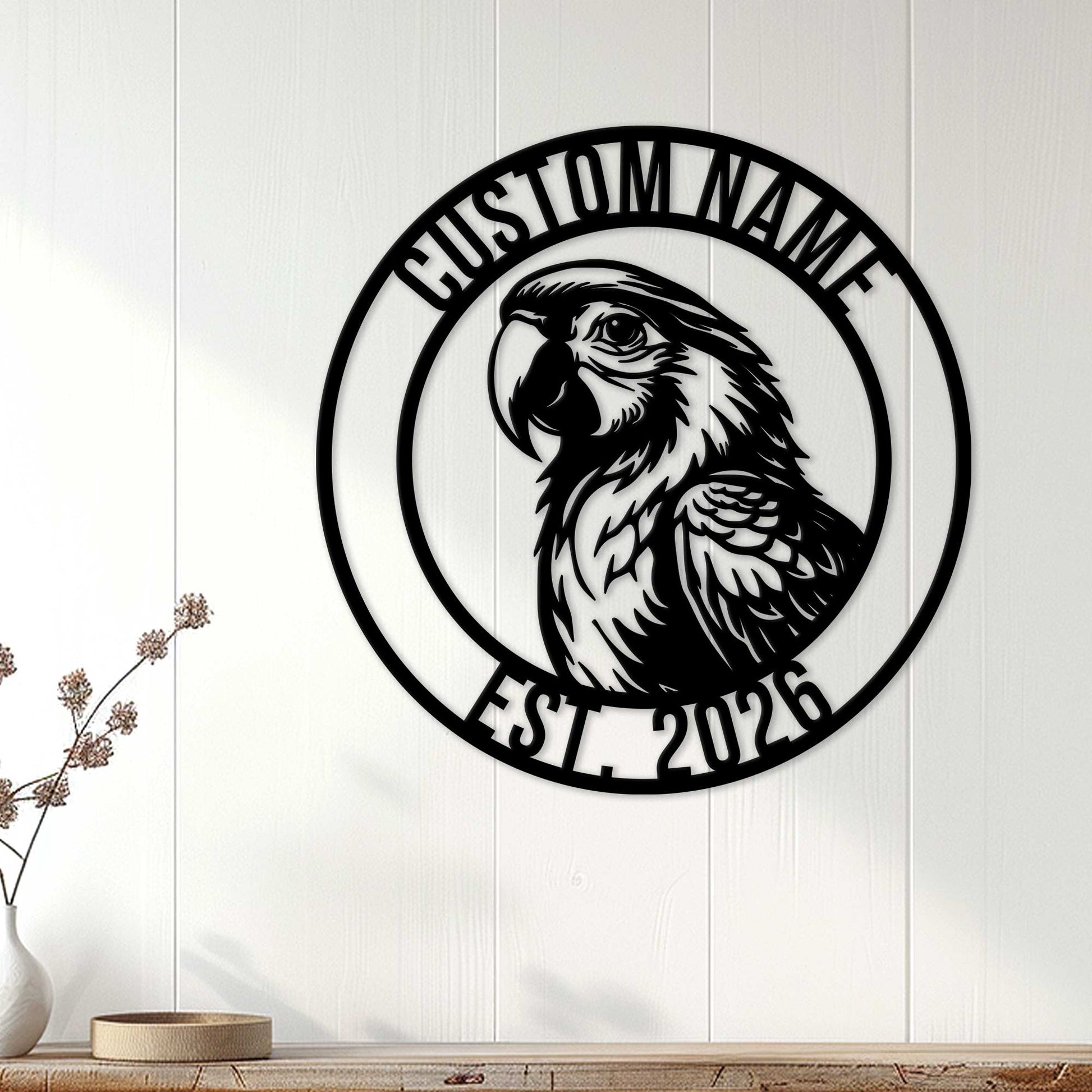 Black parrot metal wall sign displayed on white wood paneling in a home decor setting