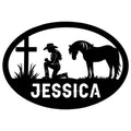 Custom cowgirl metal sign featuring a kneeling rider, horse silhouette, cross, and oval western design