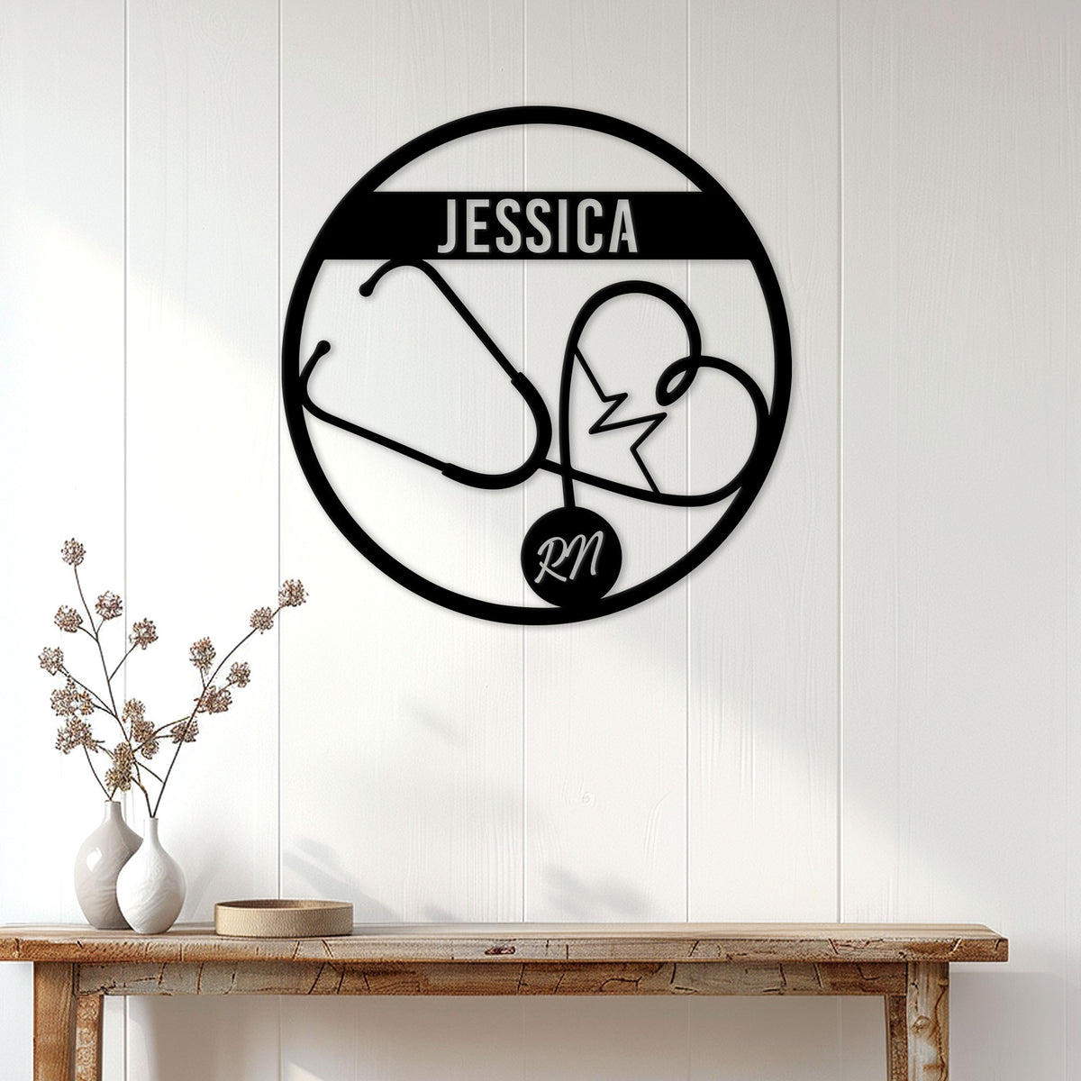 Circular nurse metal sign with a heart-shaped stethoscope displayed on a bright paneled wall