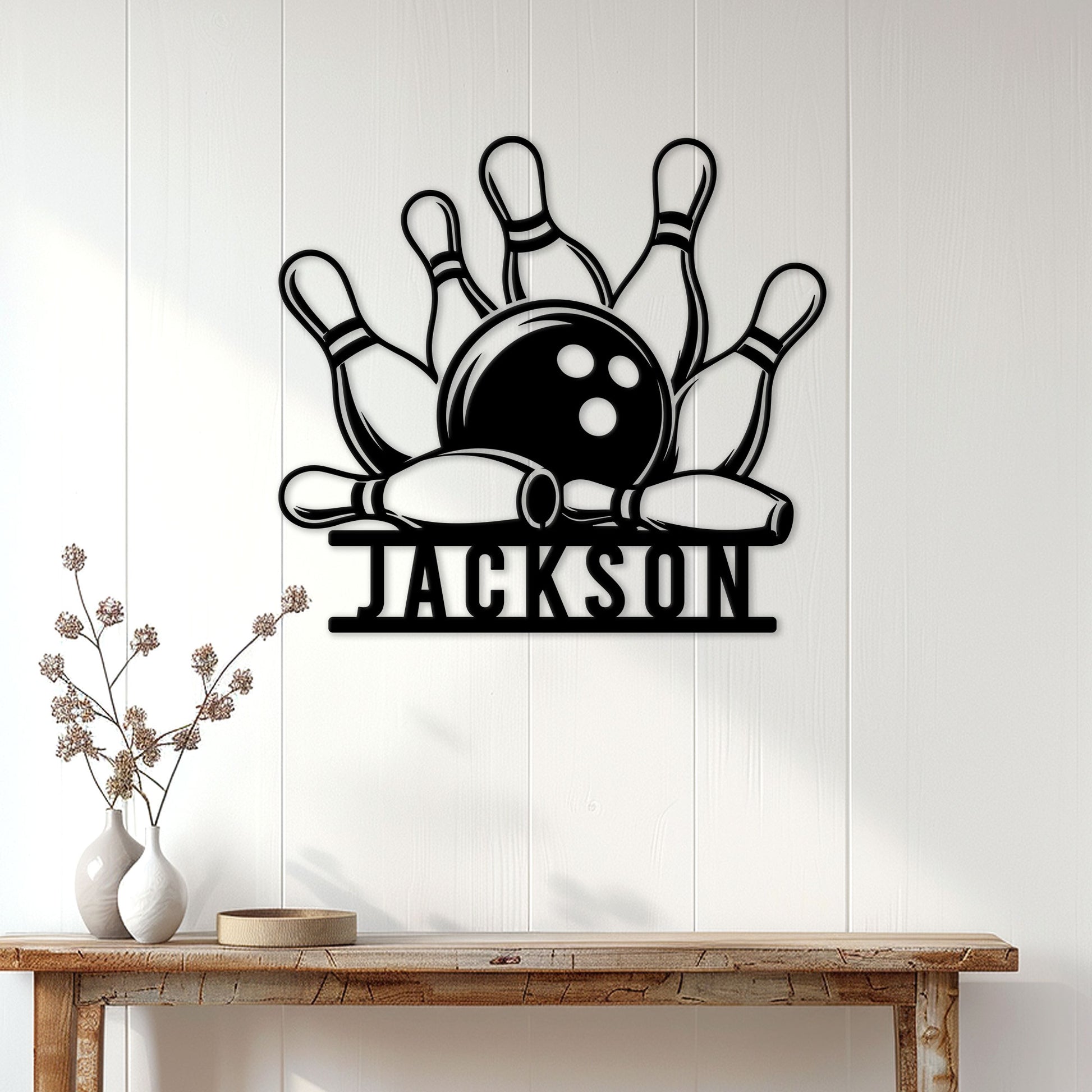 Bowling metal sign displayed on a bright paneled wall above a rustic console table