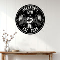 Weightlifting gym metal sign displayed on a light paneled wall above a rustic console table