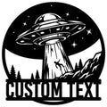 UFO metal sign featuring a flying saucer beaming up a figure over a forest and mountain landscape
