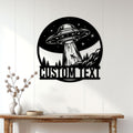 UFO wall sign displayed on a bright paneled wall above a wooden console table
