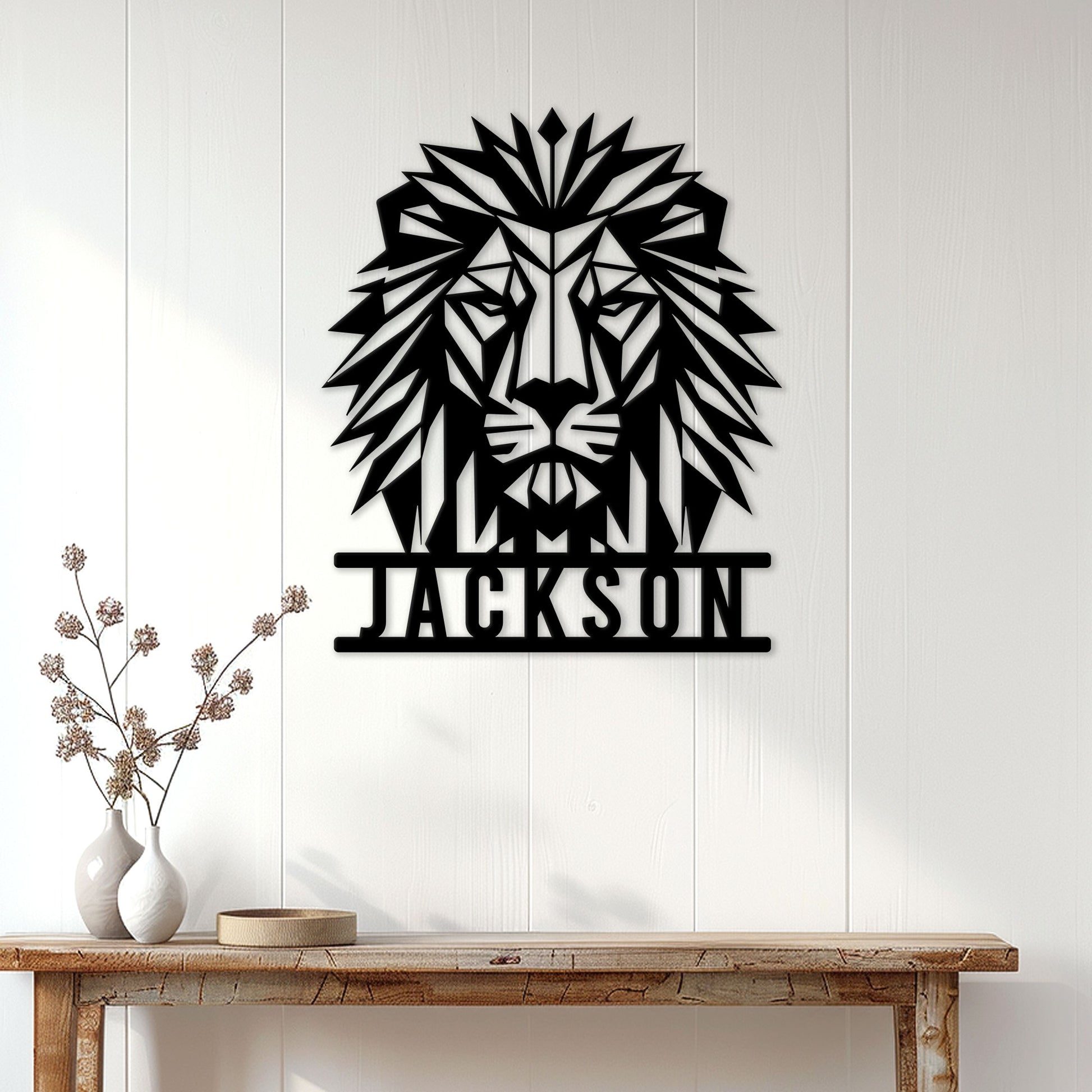 Geometric lion metal wall sign displayed on a bright paneled wall above a console table