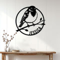 Robin bird wall decor displayed above a wood console in a bright, modern entryway