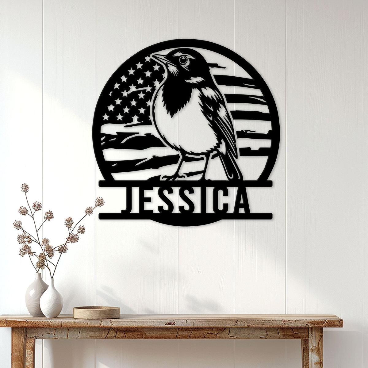 Patriotic robin metal sign displayed on a white paneled wall above a wooden console table