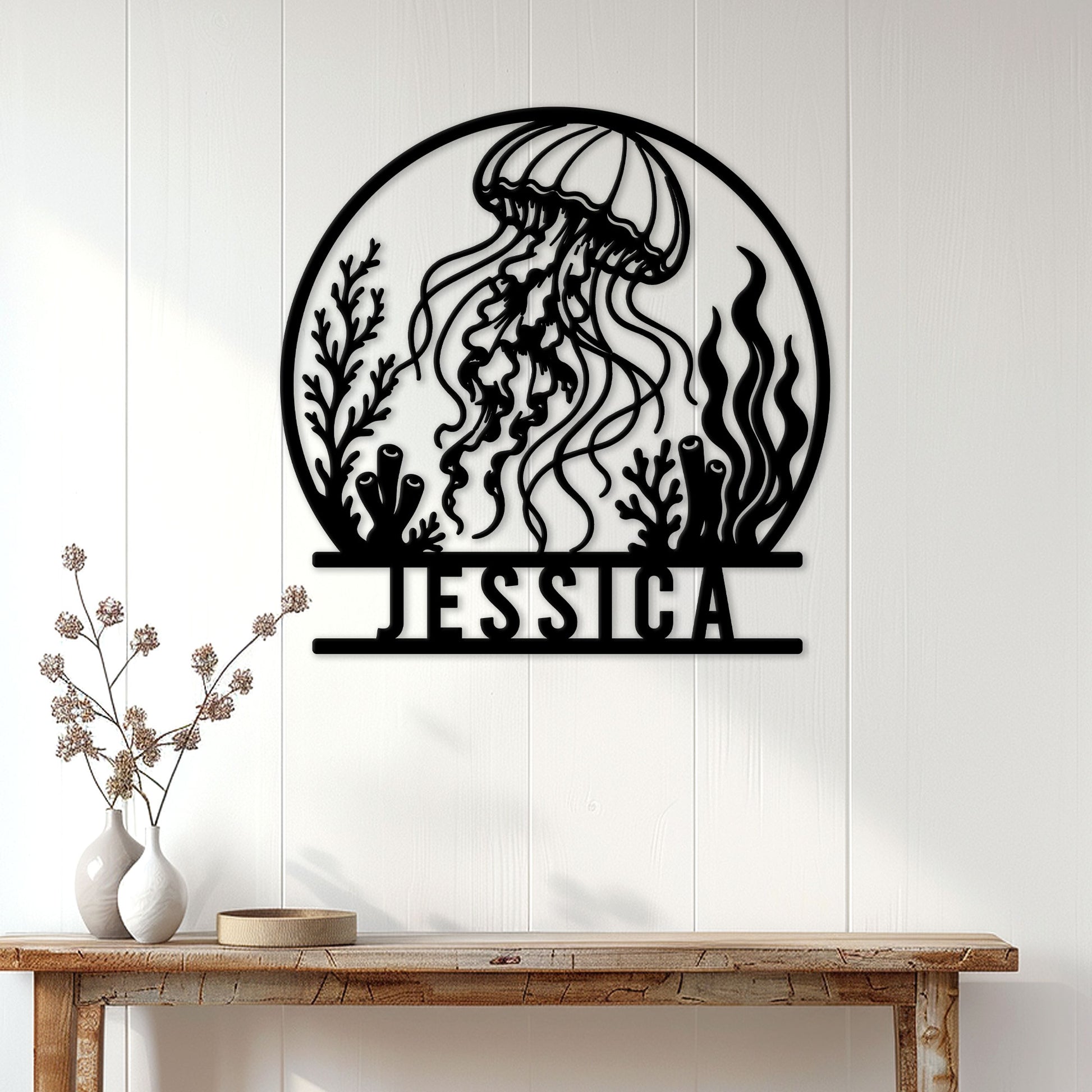 Jellyfish ocean wall decor displayed above a console table in a bright coastal home
