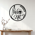 Round wine wall sign displayed above a console table in a bright modern home
