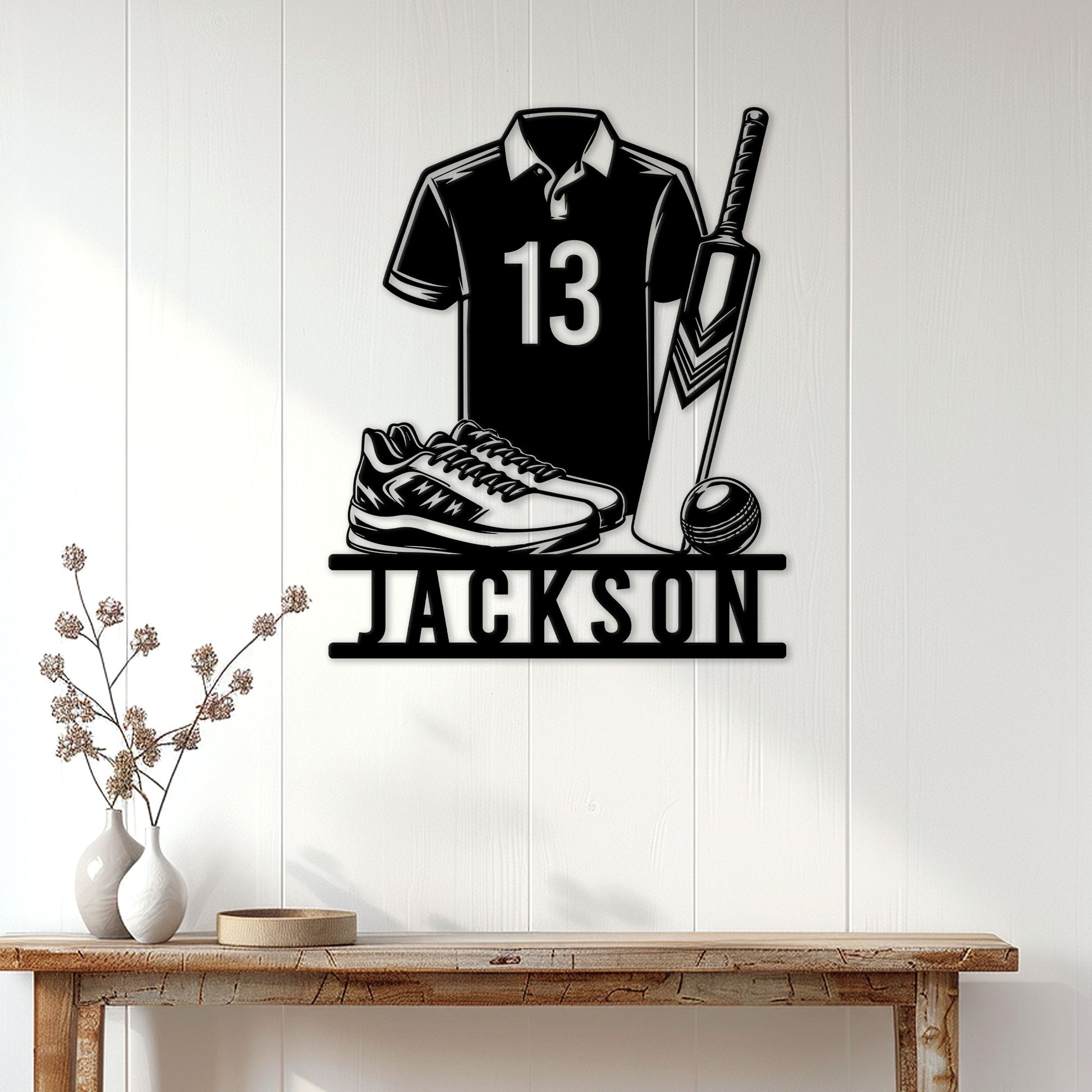 Cricket wall decor displayed on a light paneled wall above a console table in a modern home