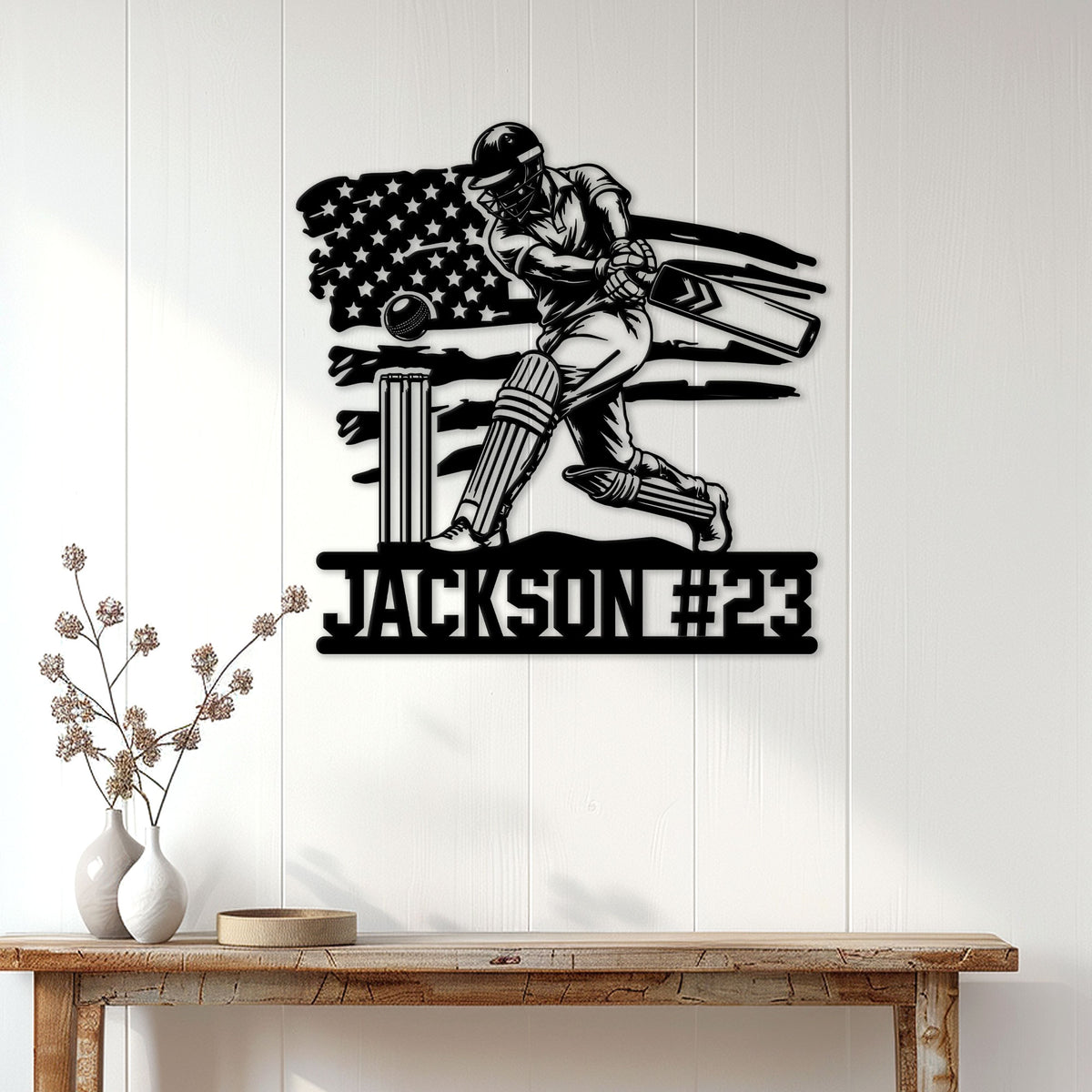 Cricket wall sign displayed above a console table, featuring a batsman with bat, ball, wickets, and flag motif