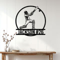 Cricket batsman metal wall sign displayed on a bright paneled wall above a console table