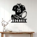 Rugby player metal wall sign displayed on a bright paneled wall above a console table
