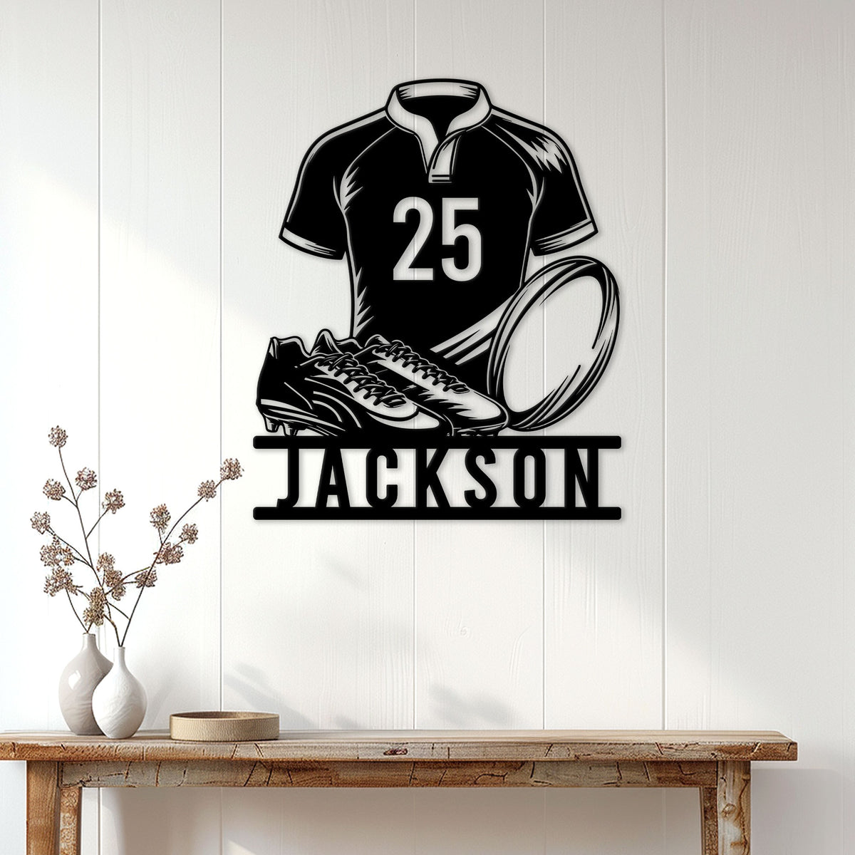 Rugby player metal wall sign displayed on a bright paneled wall above a console table