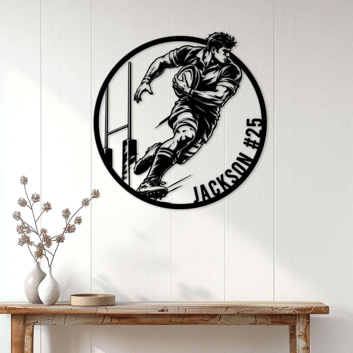 Rugby wall sign displayed on a light wood-paneled wall above a console table