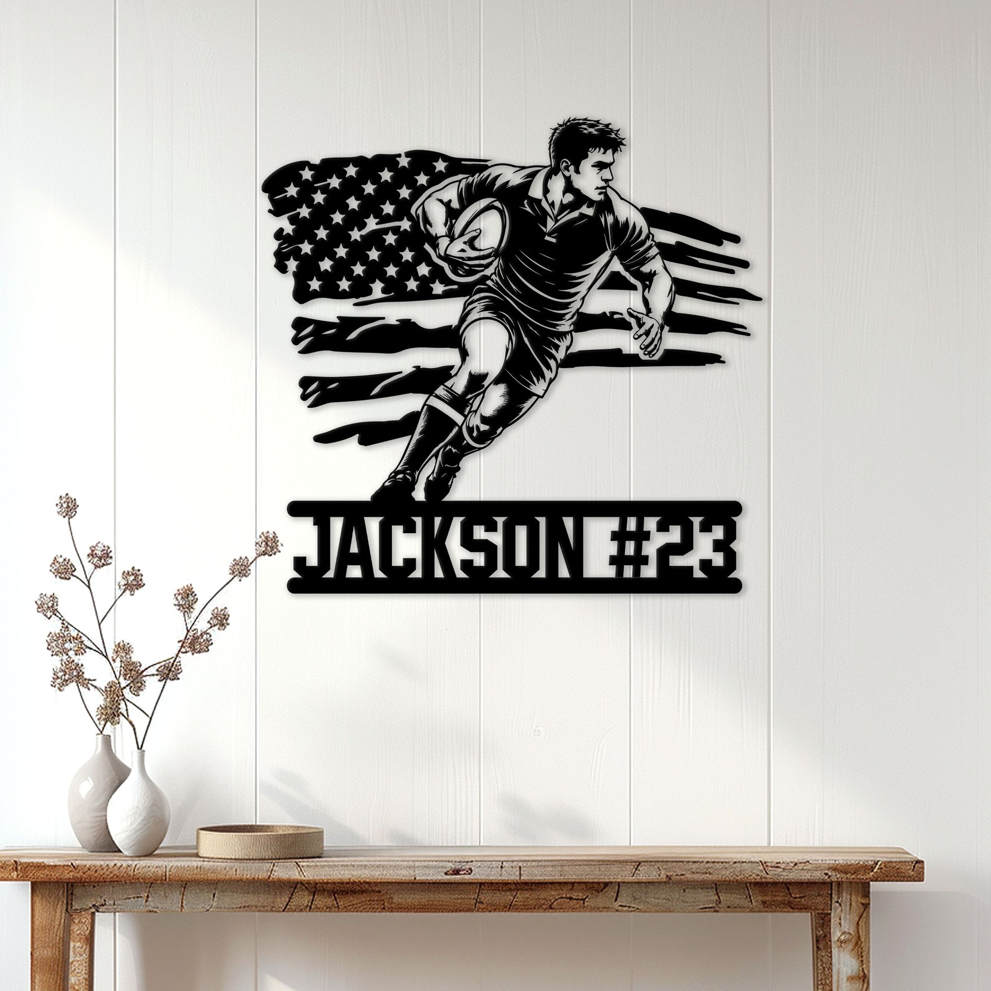 Rugby player metal wall sign displayed above a console table in a bright home interior