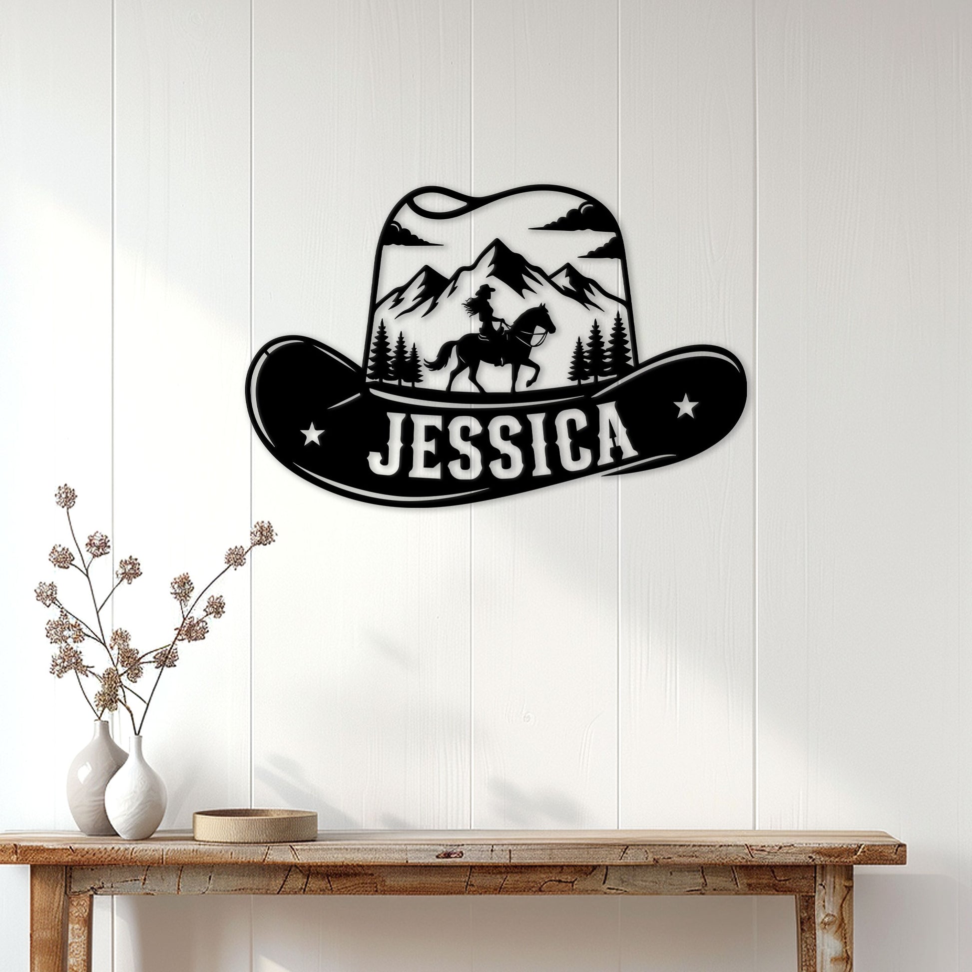 Cowgirl metal wall sign displayed on a white paneled wall above a rustic console table