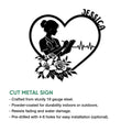 Cut metal nurse sign featuring a heart outline, medical silhouette, flowers, and ECG heartbeat detail