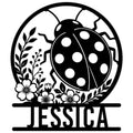Custom ladybug metal sign with a spotted beetle surrounded by flowers and leafy botanical details