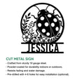 Ladybug cut metal sign featuring a floral garden silhouette and circular frame