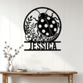 Ladybug wall sign displayed on a light wood-paneled wall above a console table