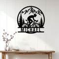 Cyclist wall sign displayed on a white paneled wall above a rustic console table