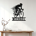 Racing cyclist metal wall sign displayed above a console table in a bright modern home