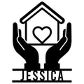 Caregiver metal sign featuring supportive hands holding a heart-filled home in a bold black silhouette