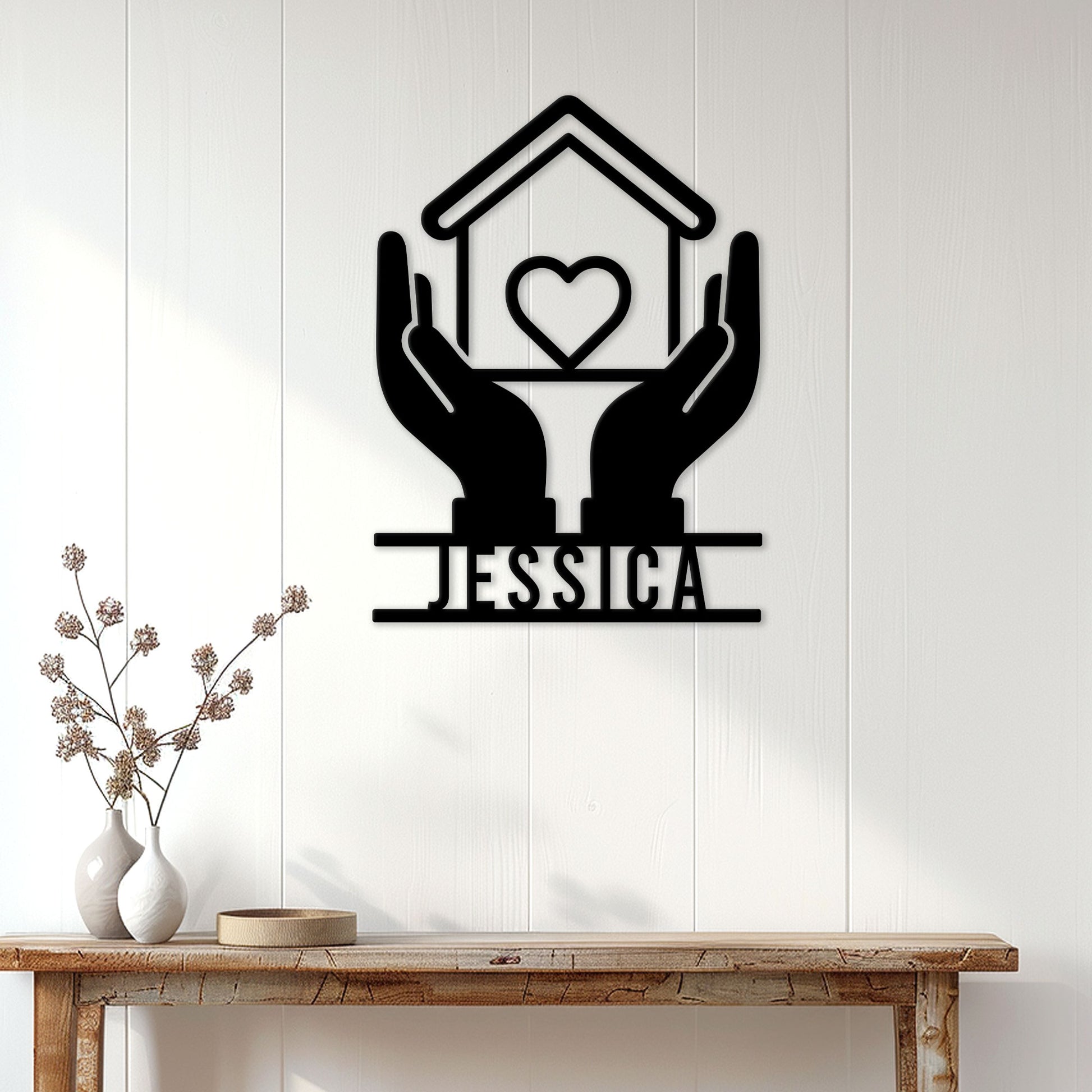 Caregiver metal wall decor displayed on a bright entryway wall above a console table