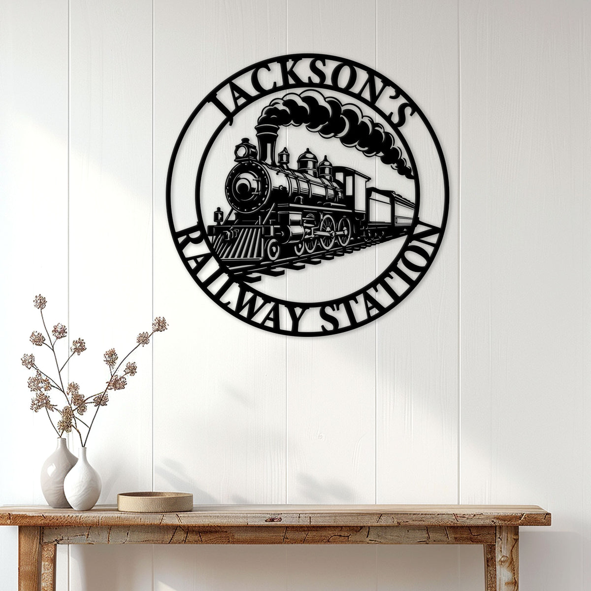 Railroad wall decor displayed above a console table in a bright home entryway