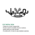 Plumbing wall sign shown as a cut metal design with crossed wrenches and detailed pipe fittings