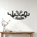 Plumber metal wall decor displayed on a light wood-paneled wall above a console table