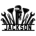 Custom plumber metal sign featuring wrenches, pipe tools, a faucet, and bold workshop-inspired wall art
