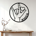 ASL sign language wall decor displayed on a bright paneled wall above a console table
