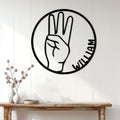 American Sign Language hand gesture metal sign styled as wall decor above a wood console table