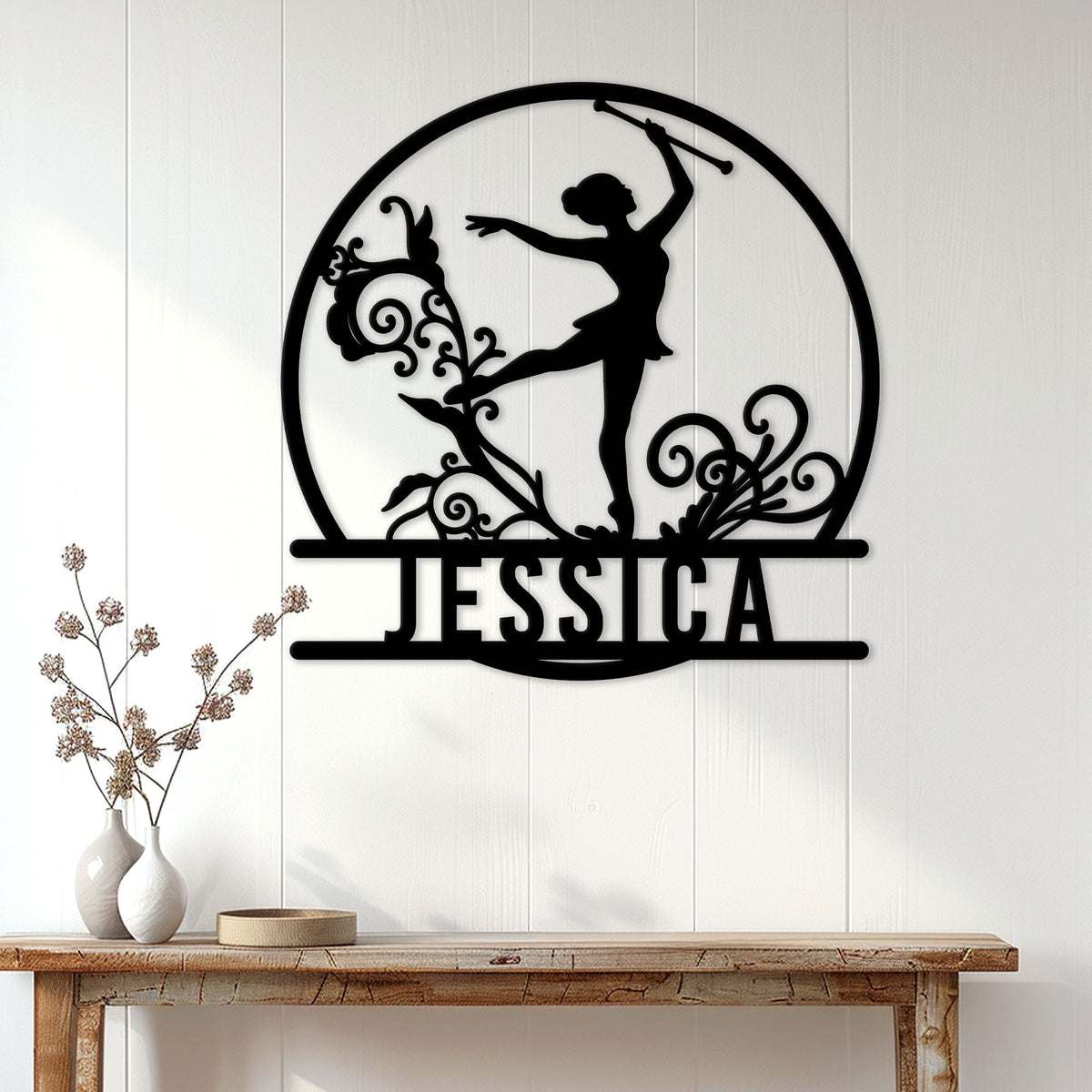Baton twirling wall decor displayed on a white paneled wall above a rustic console table