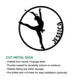 Round baton twirling sign featuring a dramatic silhouette of a performer balancing with a baton