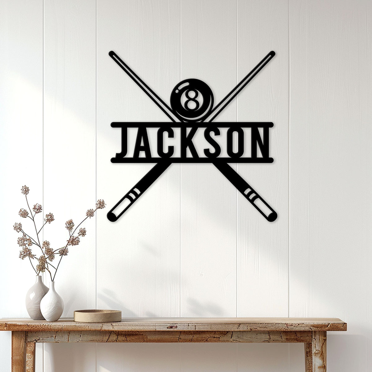 Billiards wall sign displayed above a console table with an 8 ball and crossed pool cues