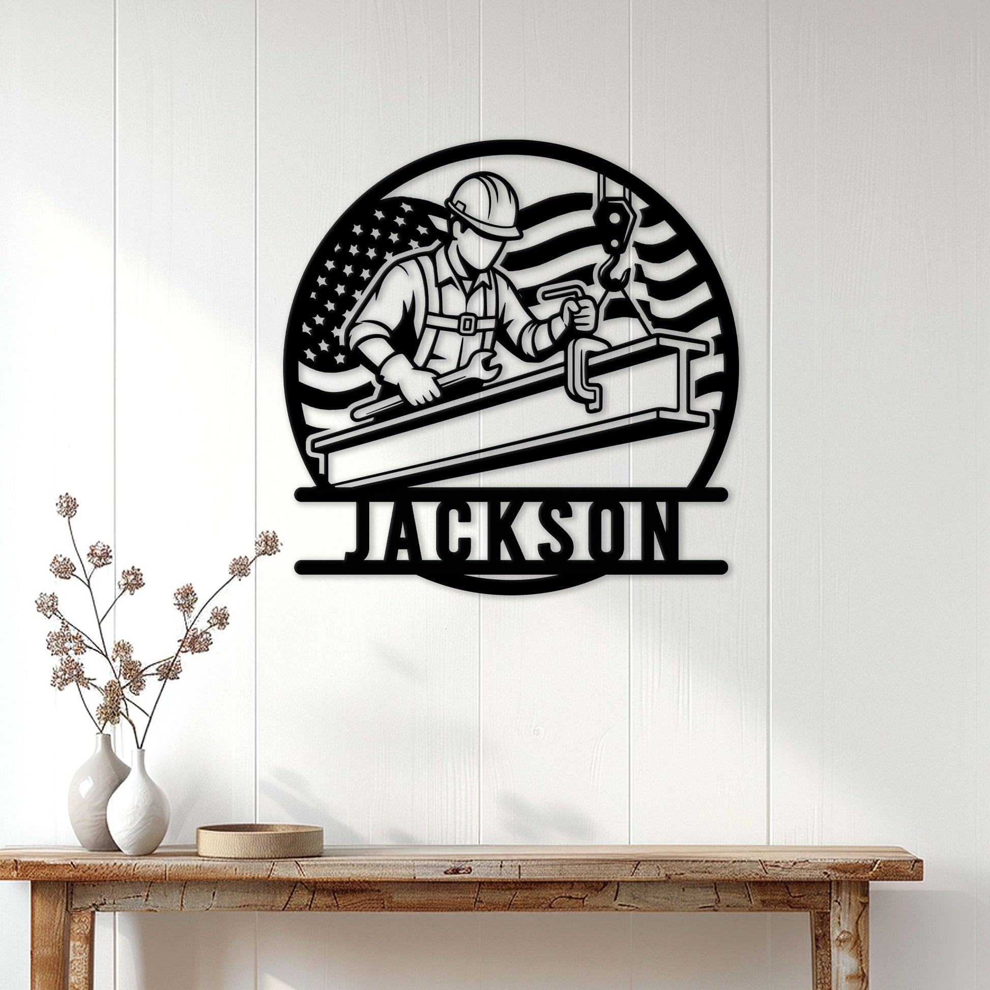 Patriotic ironworker wall sign displayed on a white wood-paneled wall above a console table