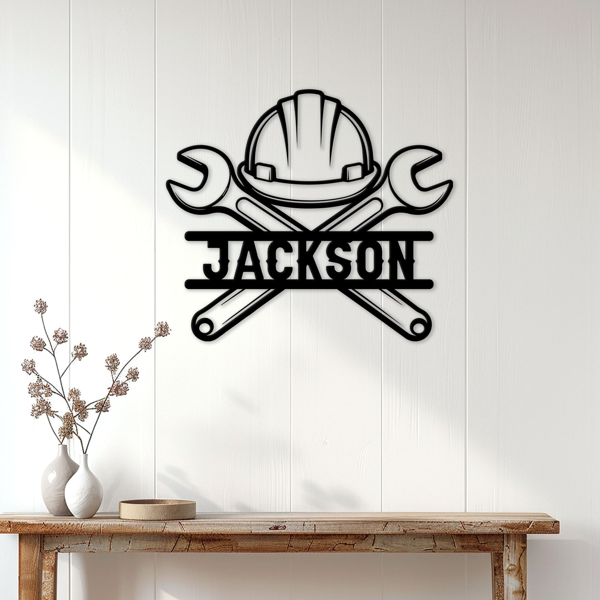 Ironworker wall sign displayed on white paneling above a rustic console table in a modern entryway