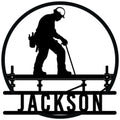 Ironworker metal sign featuring a hard-hat worker balancing on a steel beam in bold silhouette