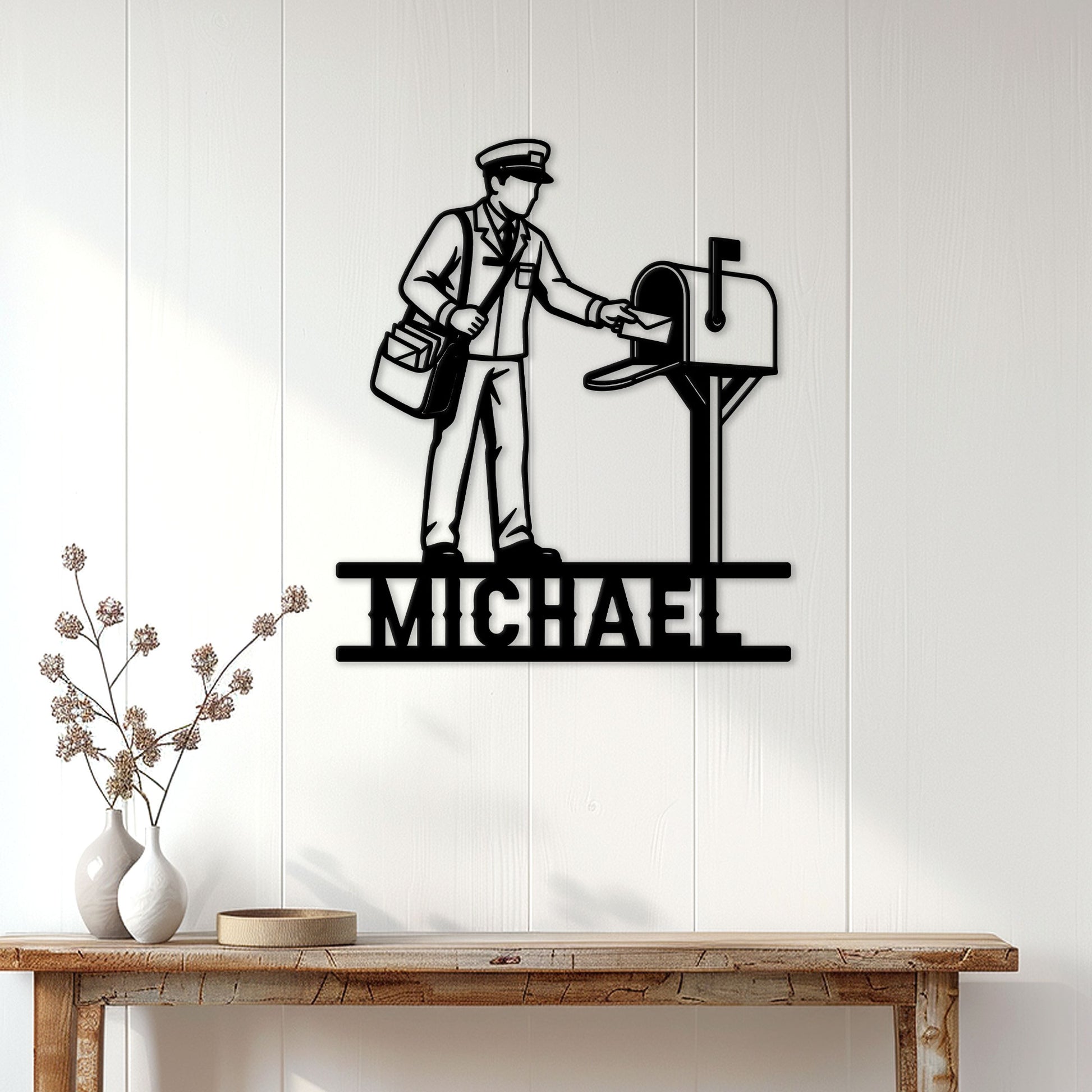 Postal worker metal wall sign displayed on a white paneled entryway above a console table