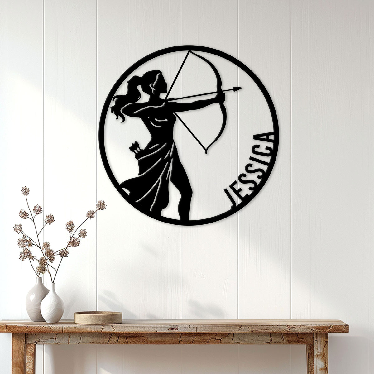 Sagittarius zodiac metal sign with an archer silhouette displayed on a light paneled wall