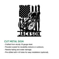 Cut metal cyclist sign featuring a road bike and patriotic American flag artwork