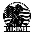 Black metal kitchen sign featuring a chef silhouette framed by a waving American flag