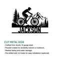 Mountain bike wall sign shown with a bold trail rider silhouette, forest landscape, and mountain backdrop