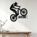 Mountain biking wall decor displayed above a console table in a bright modern home interior