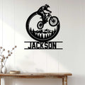 Mountain biking wall decor displayed on a light wood wall above a console table
